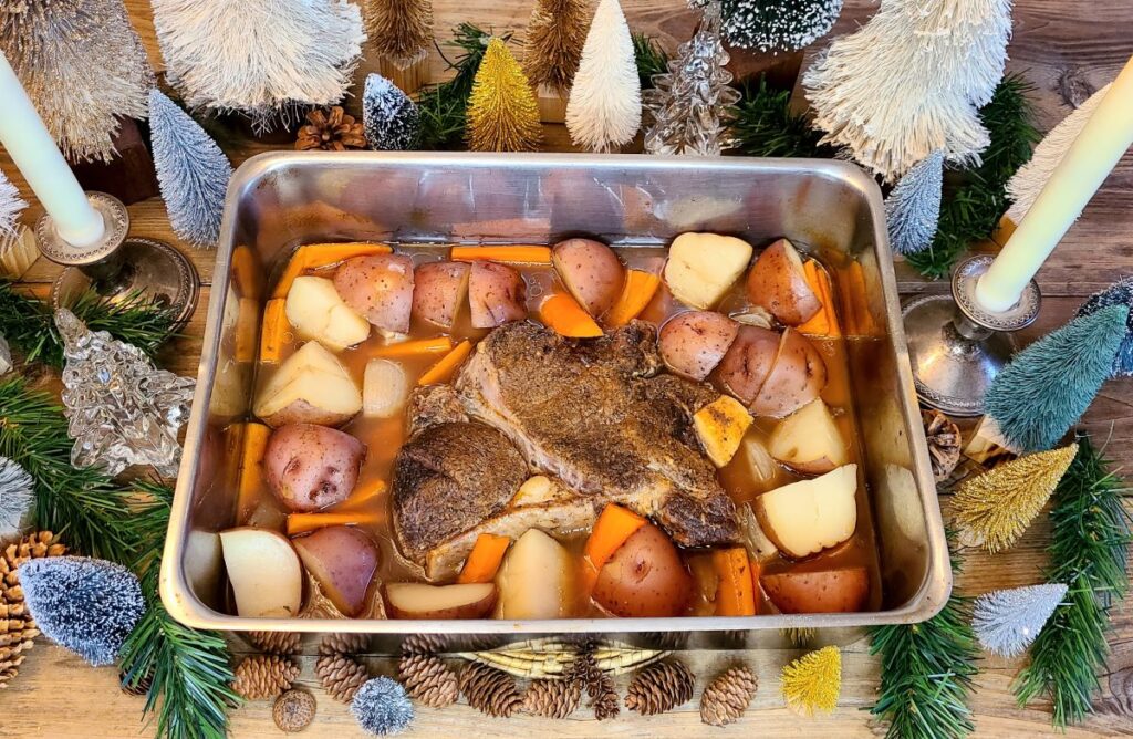 Beef roast set among decorative bottle brush trees and a festive design.