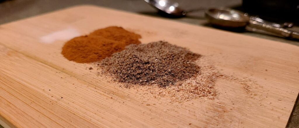Close up warm spices on cutting board.