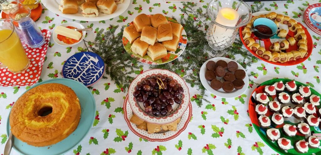 Easy Yule dinner ideas and recipes for a magical feast.  Food laid out on a festive table cloth