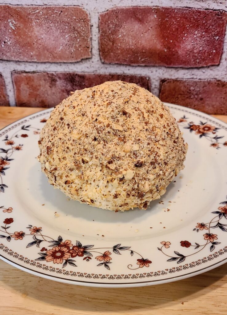 Easy low carb cheese ball with mascarpone and gouda on a plate