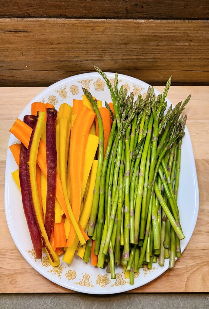 sliced carrots and asparagus on a platter