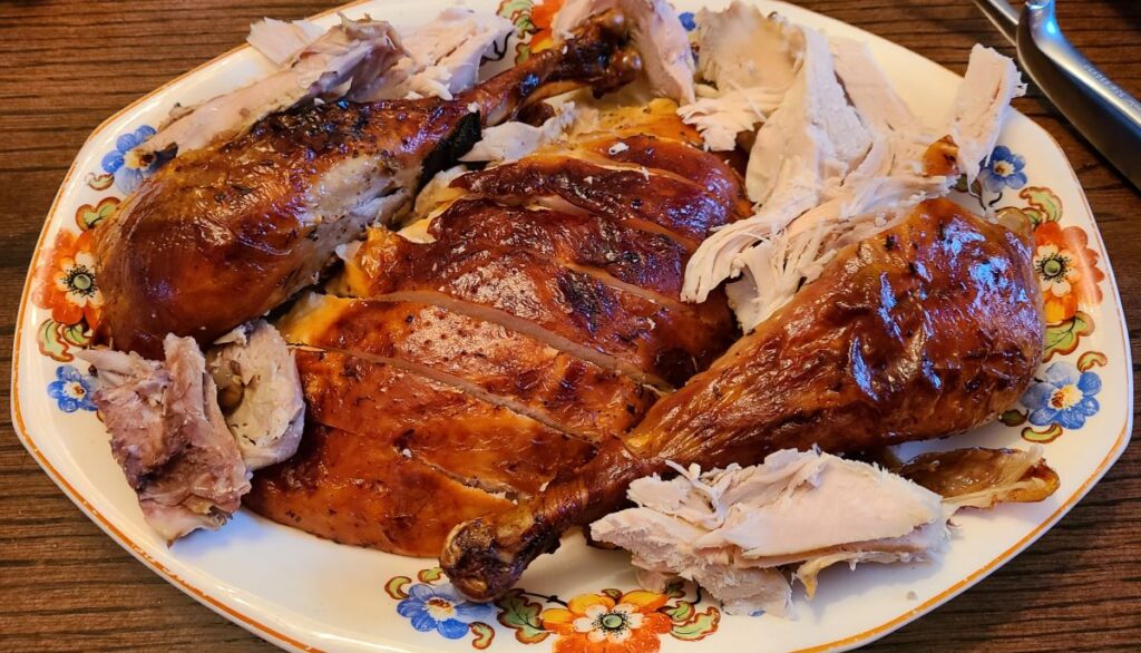 Sliced turkey meat on a platter. 
