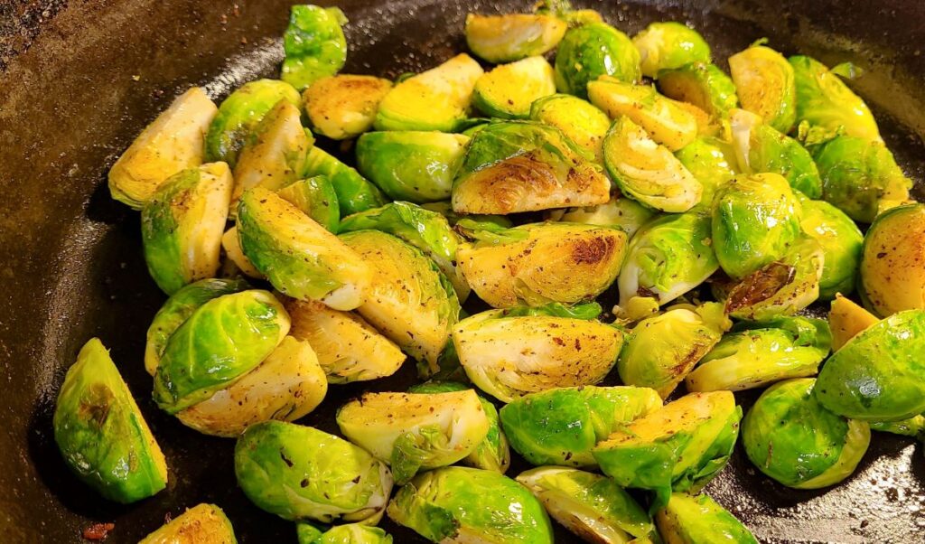 Cut brussels sprouts cooking in a pan